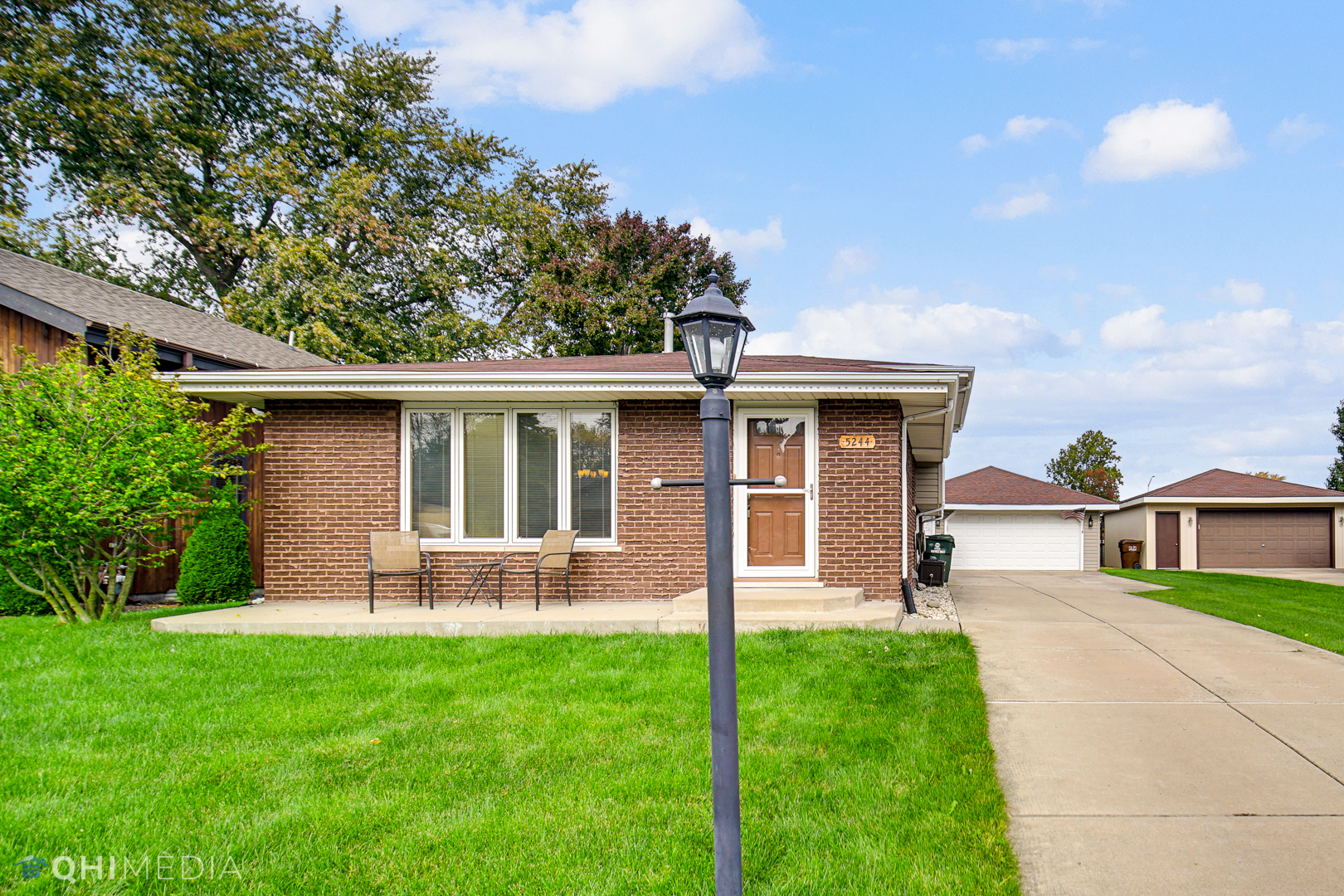 5244 170th Street Oak Forest, IL 60452 - Photo 2 of 24 a front view of a house with a yard and potted plants