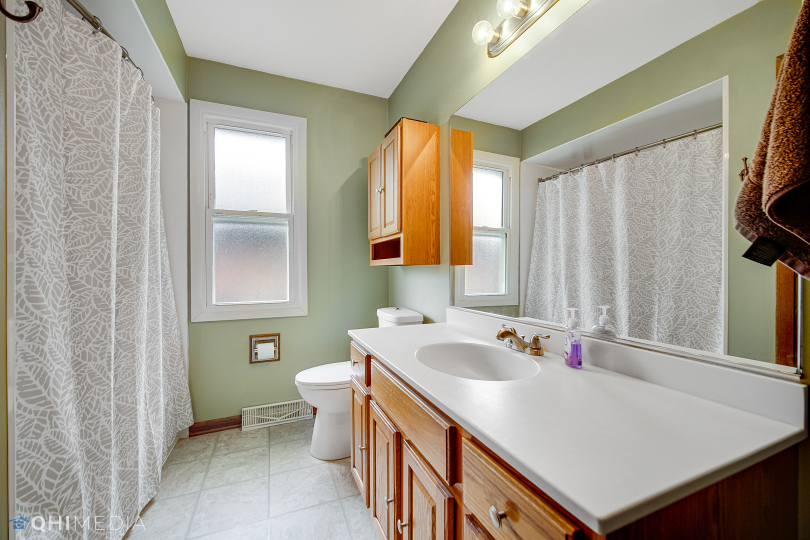 5244 170th Street Oak Forest, IL 60452 - Photo 16 of 24 a bathroom with a sink and a mirror