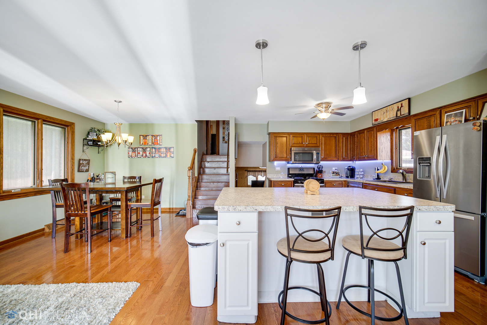 5244 170th Street Oak Forest, IL 60452 - Photo 5 of 24 a dining room with stainless steel appliances granite countertop a dining table chairs refrigerator and sink