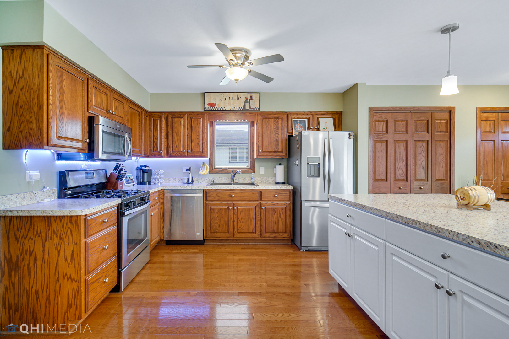 5244 170th Street Oak Forest, IL 60452 - Photo 8 of 24 a kitchen with stainless steel appliances granite countertop a sink a stove cabinets and wooden floor
