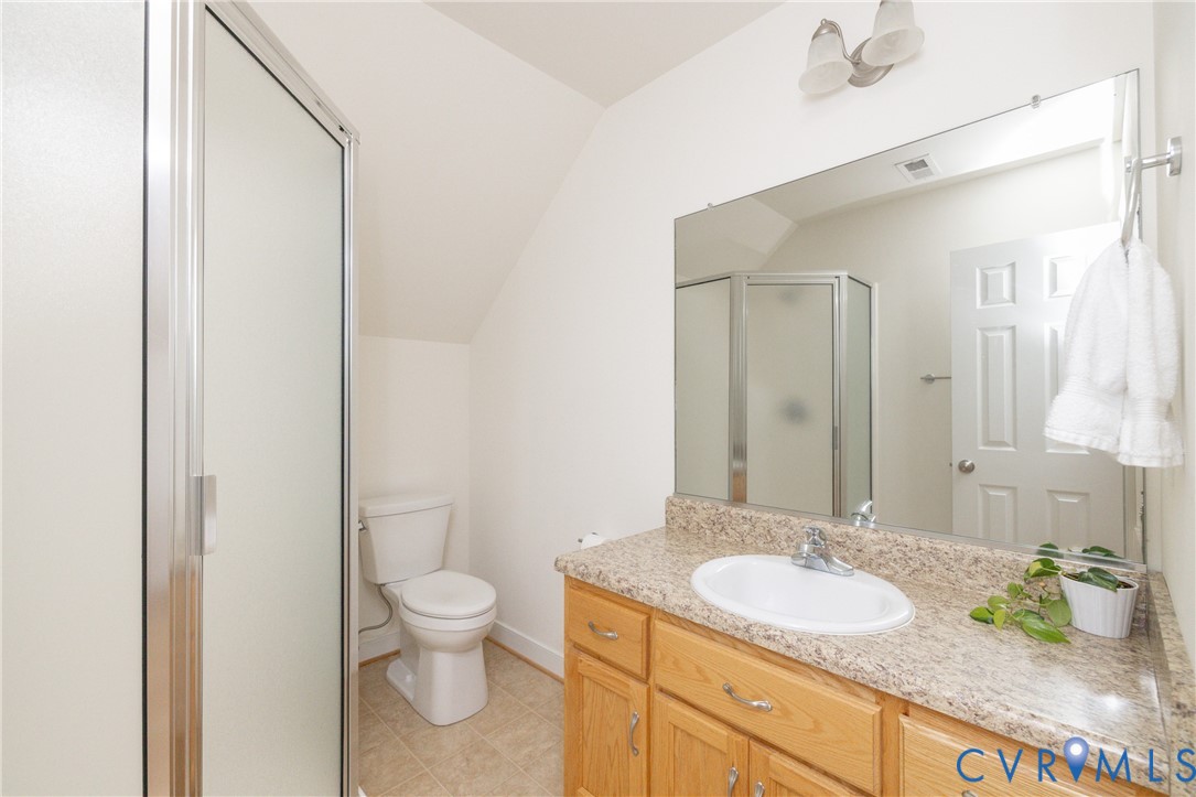 15618 Rowlett Road Chesterfield, VA 23838 - Photo 20 of 29 a bathroom with a granite countertop sink toilet and shower