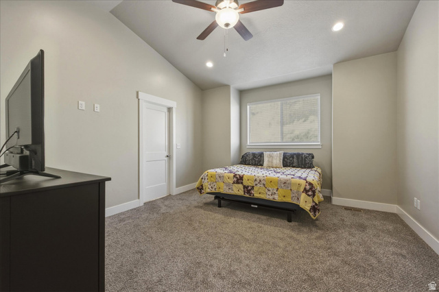 45 Memory Lane Tooele, UT 84074 - Photo 15 of 30 Carpeted bedroom with lofted ceiling, a ceiling fan, and recessed lighting