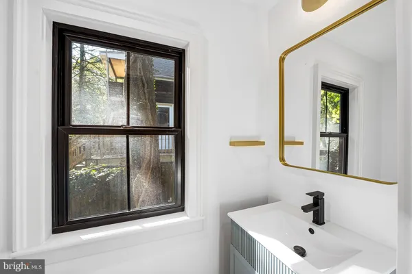 a bathroom with a sink and mirror