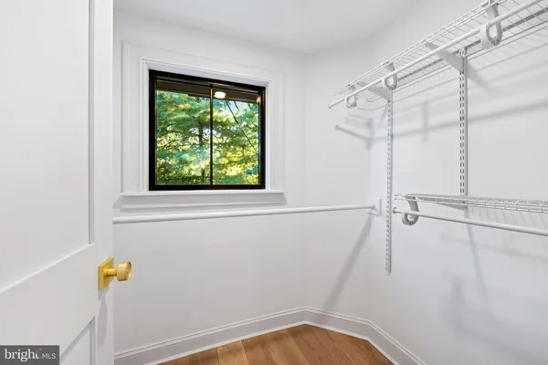 a view of walk in closet with window