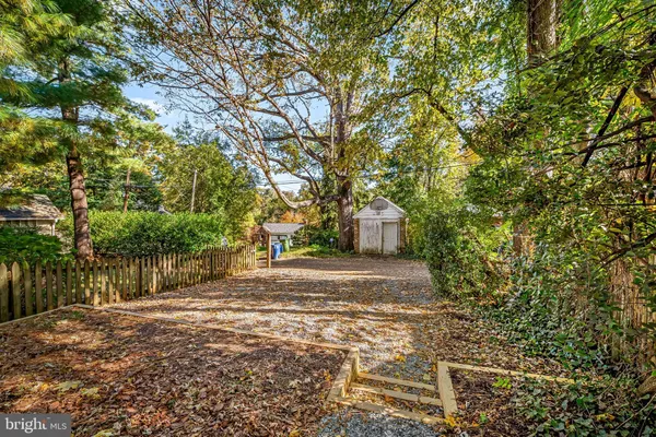 a picture of a bench in front of a wall
