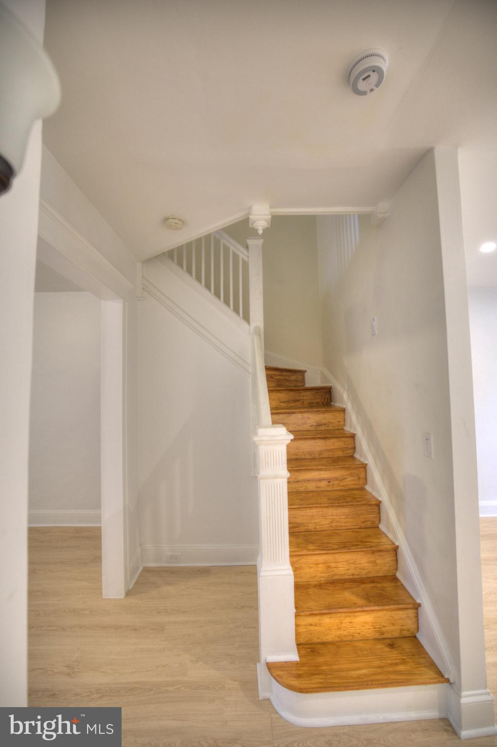 608 East 33rd Street Baltimore, MD 21218 - Photo 7 of 17 Wooden staircase