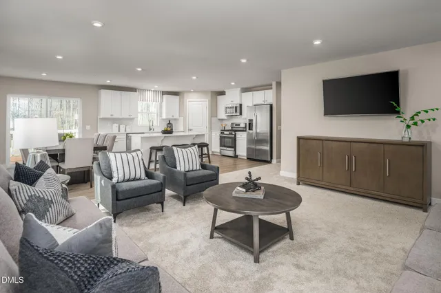 a large kitchen with a table and chairs