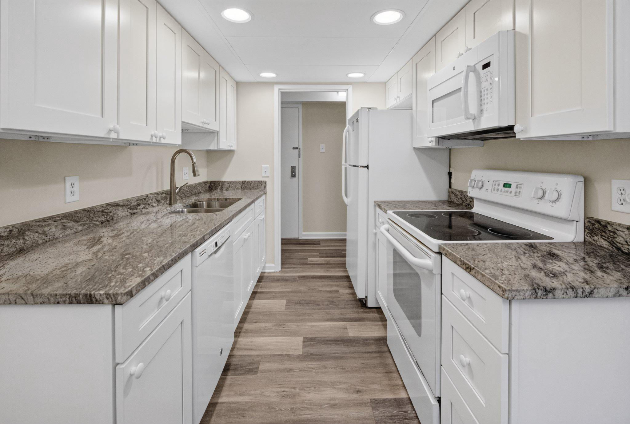 11617 Stoneview Square, Unit 1B Reston, VA 20191 - Photo 3 of 18 Modern kitchen with sleek finishes. View 2 of 4.
