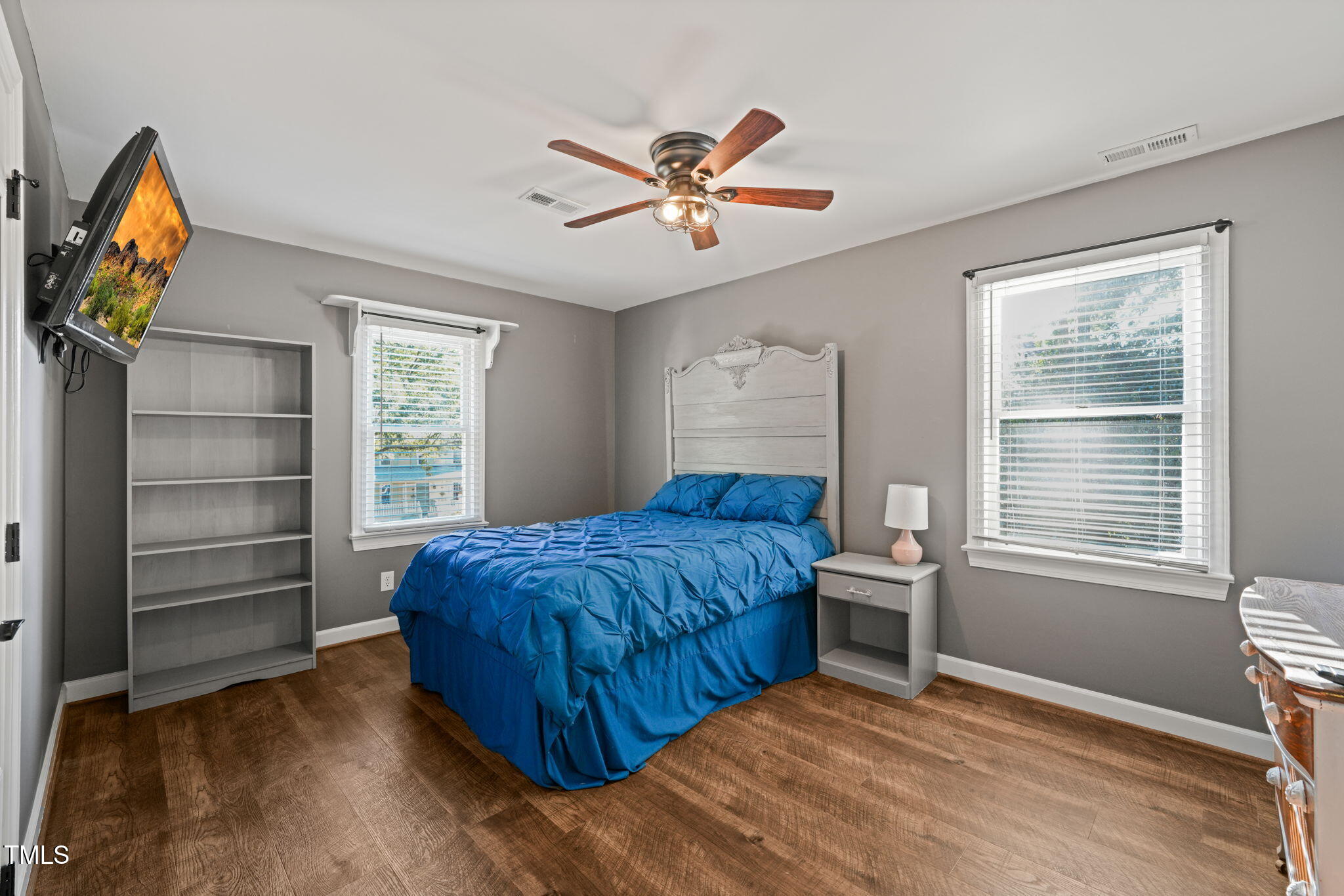 7125 Sandringham Drive Raleigh, NC 27613 - Photo 13 of 26 a bedroom with a bed and a window