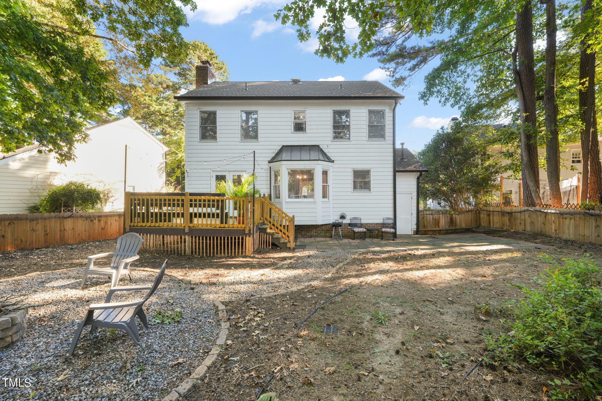7125 Sandringham Drive Raleigh, NC 27613 - Photo 20 of 26 a view of a house with backyard and a tree