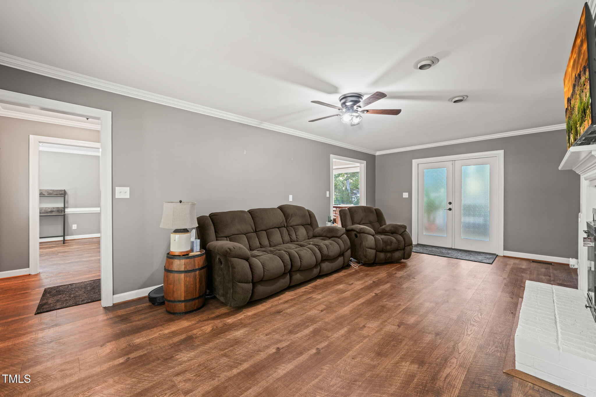 7125 Sandringham Drive Raleigh, NC 27613 - Photo 3 of 26 a living room with furniture and wooden floor