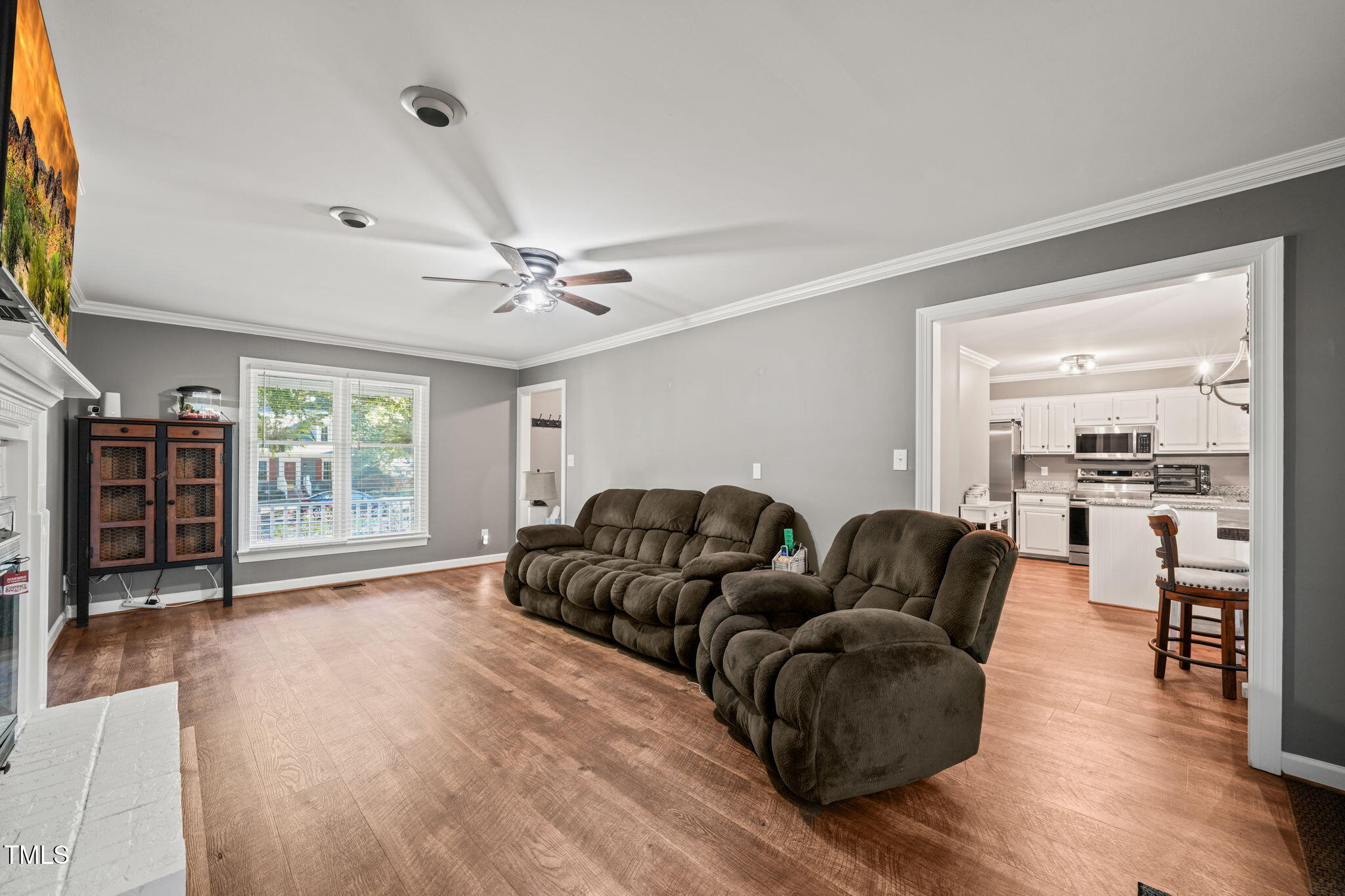 7125 Sandringham Drive Raleigh, NC 27613 - Photo 4 of 26 a living room with furniture and wooden floor