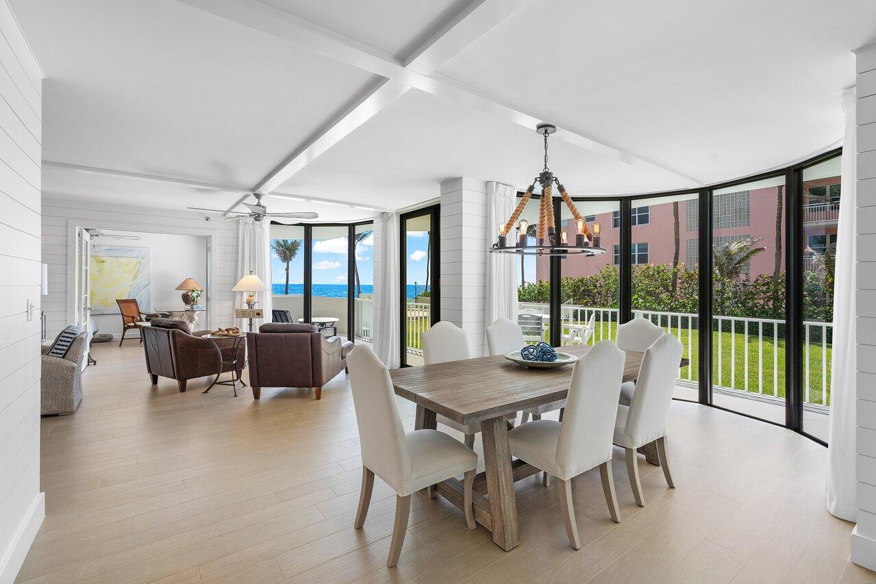 2917 South Ocean Boulevard, Unit 104 Highland Beach, FL 33487 - Photo 2 of 57 a view of a dining room with furniture window and outside view
