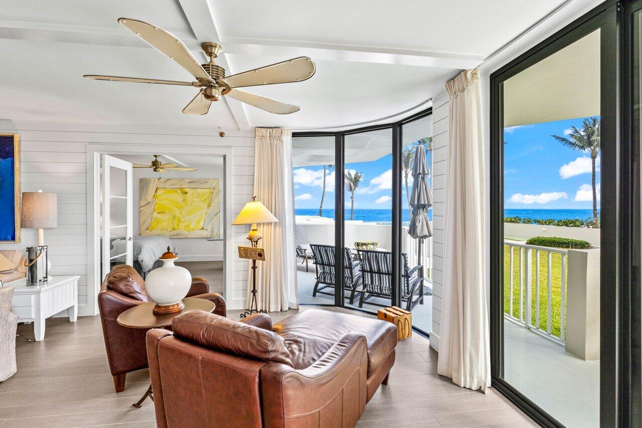 2917 South Ocean Boulevard, Unit 104 Highland Beach, FL 33487 - Photo 31 of 57 a living room with furniture and a large window