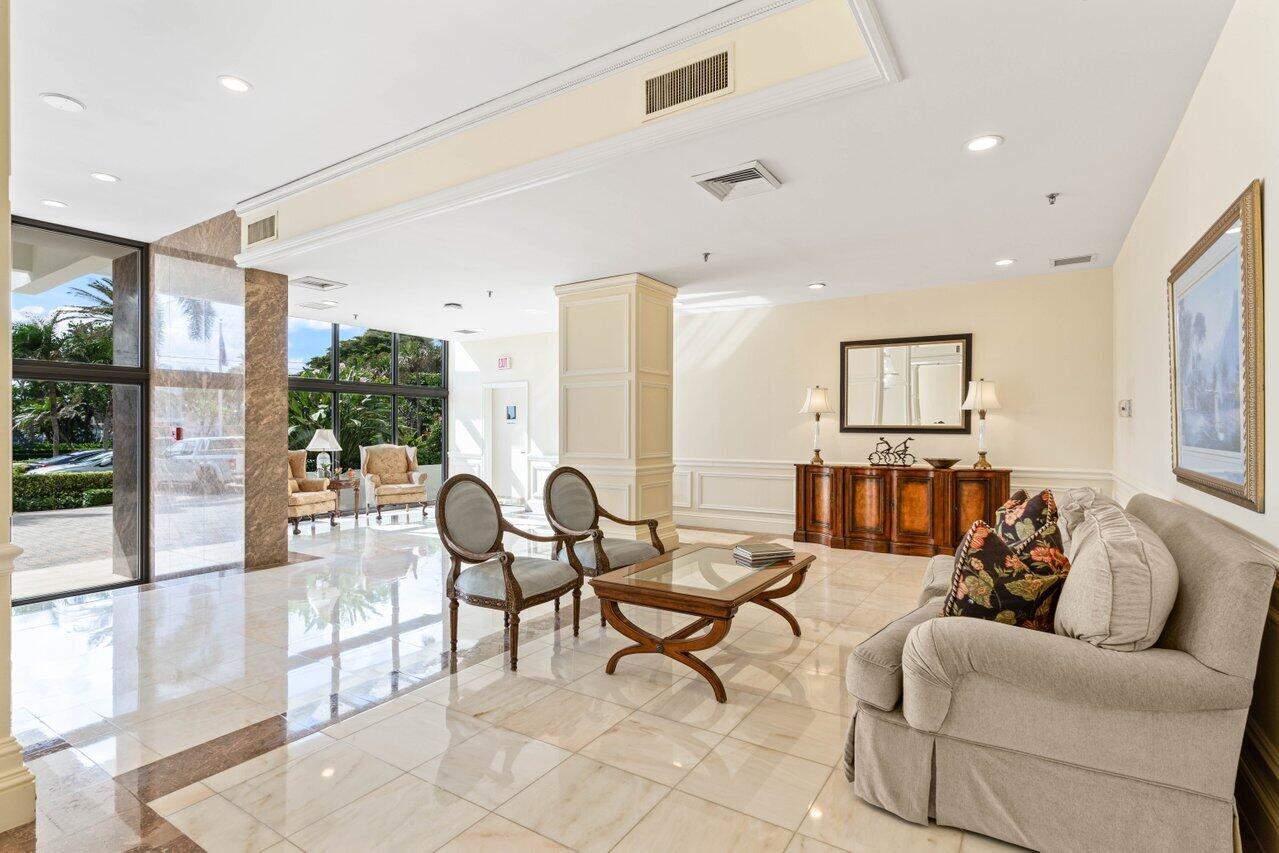 2917 South Ocean Boulevard, Unit 104 Highland Beach, FL 33487 - Photo 43 of 57 a living room with furniture and a large window