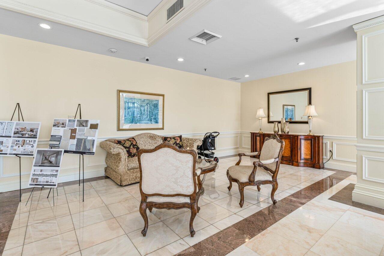 2917 South Ocean Boulevard, Unit 104 Highland Beach, FL 33487 - Photo 44 of 57 a living room with furniture and a table