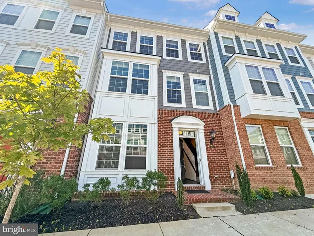 a front view of a multi story residential apartment building