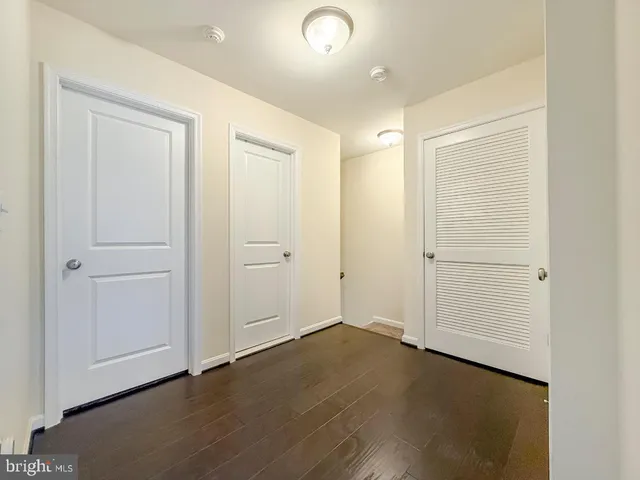 an empty room with wooden floor