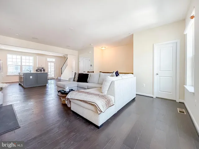 a room with a bed and large wooden floor