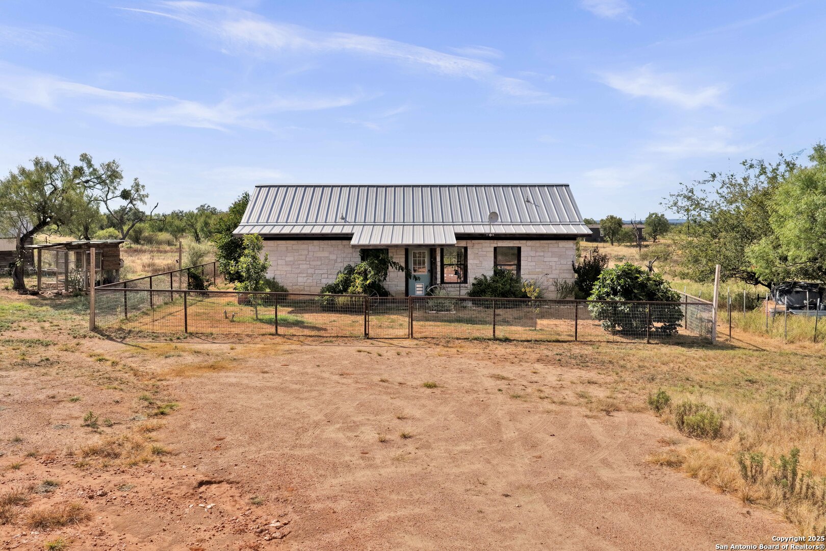 127 Offer Llano, TX 78643 - Photo 2 of 29 a view of a house with backyard and sitting area