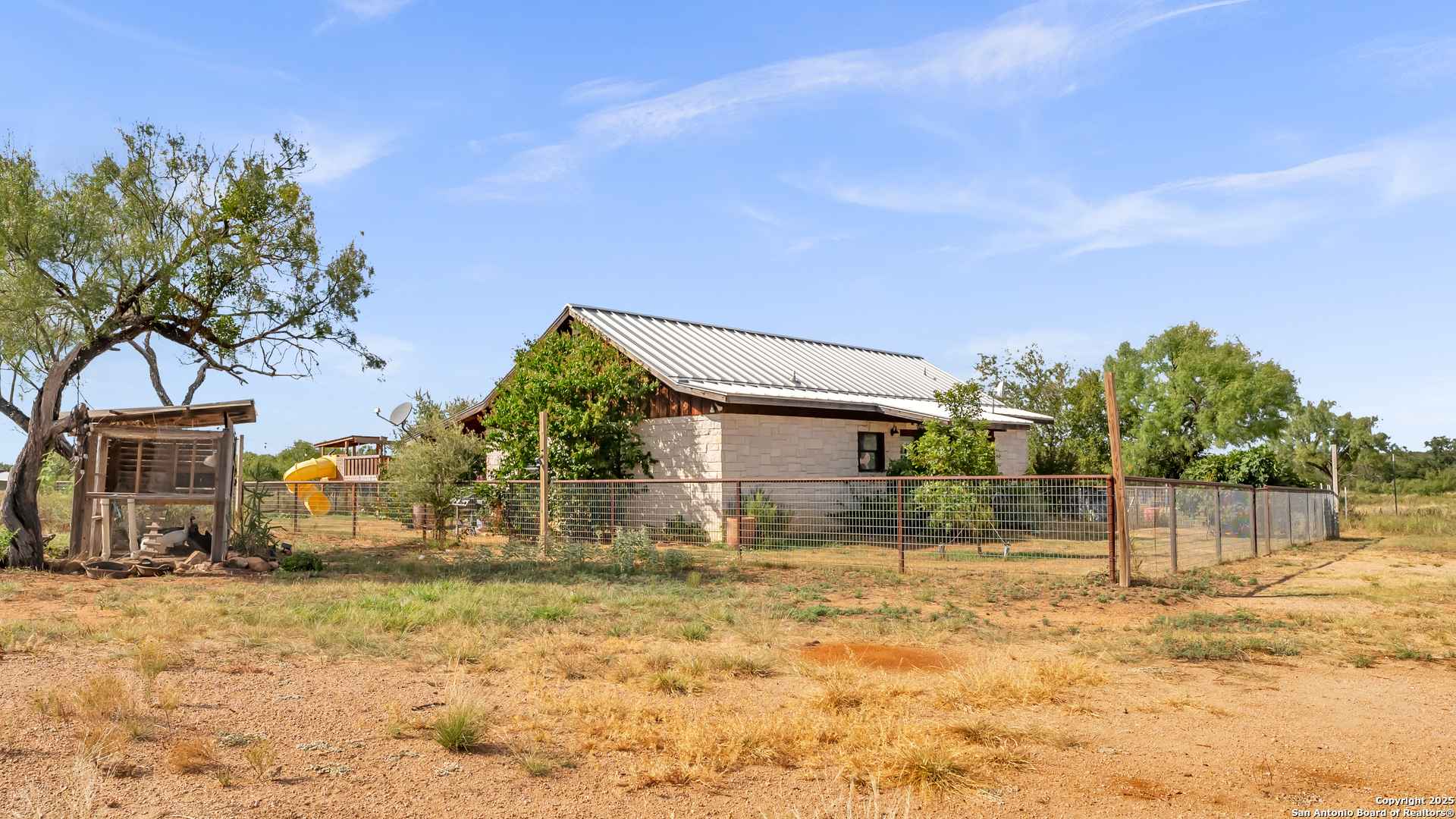 127 Offer Llano, TX 78643 - Photo 28 of 29 a backyard of a house with table and chairs