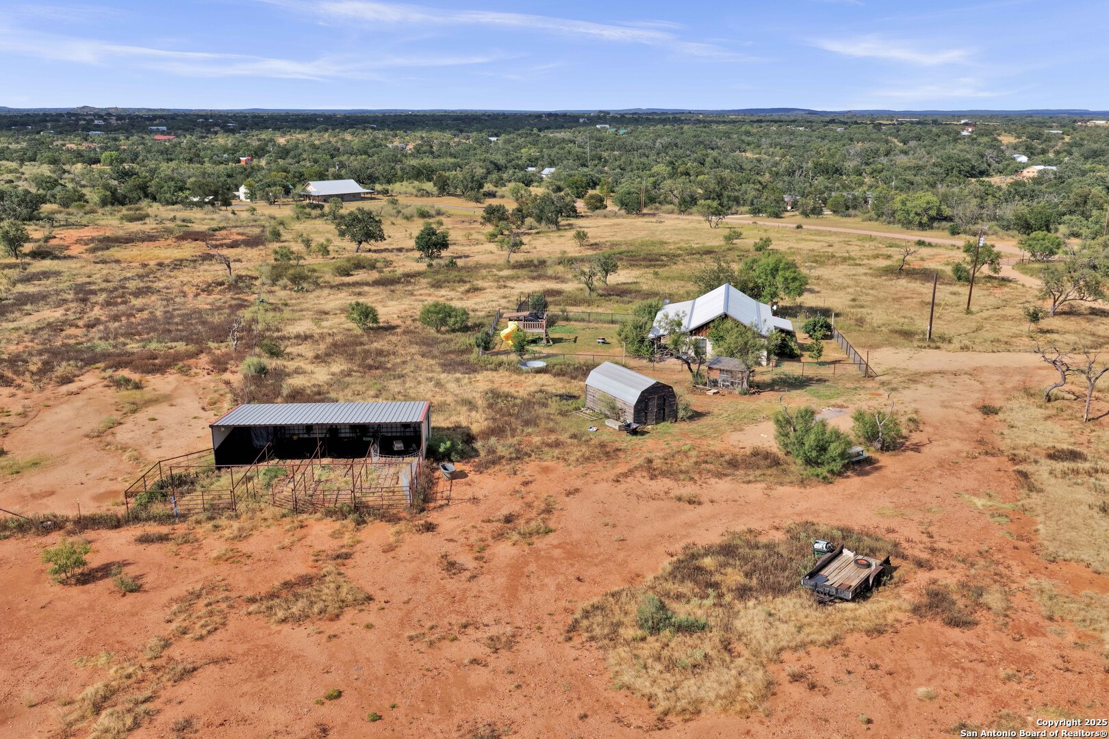 127 Offer Llano, TX 78643 - Photo 3 of 29 an aerial view of residential houses with outdoor space