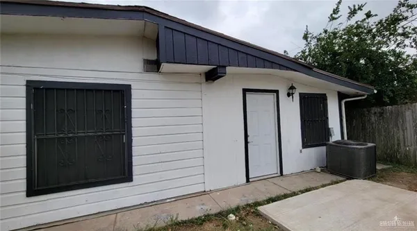 a kitchen with stainless steel appliances a refrigerator and microwave