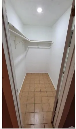 a kitchen with a stove and a refrigerator