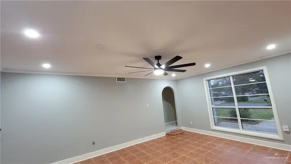 an empty room with a empty space and a window