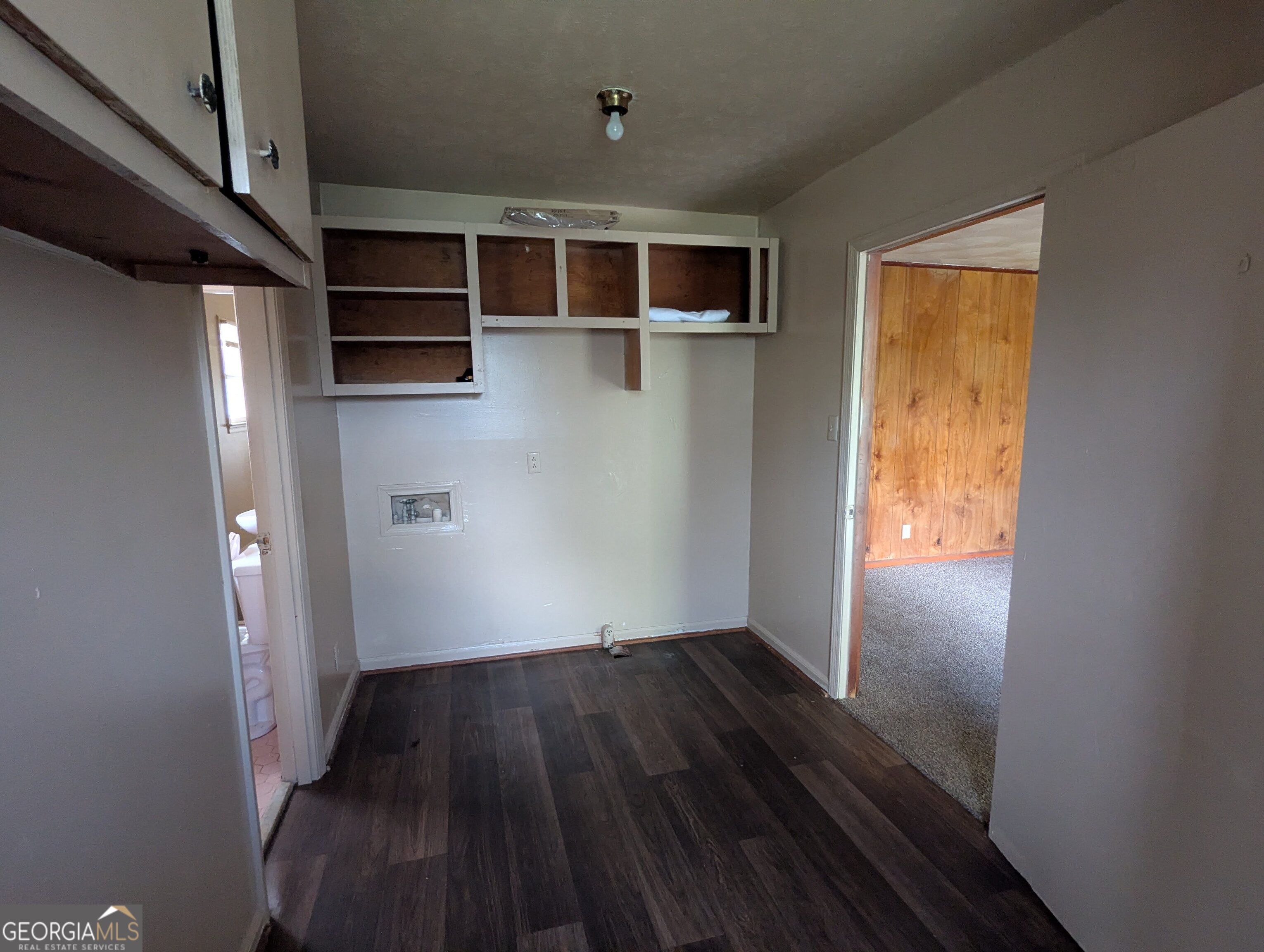 611 West Whitney Avenue Albany, GA 31701 - Photo 11 of 15 a view of a big room with wooden floor and windows