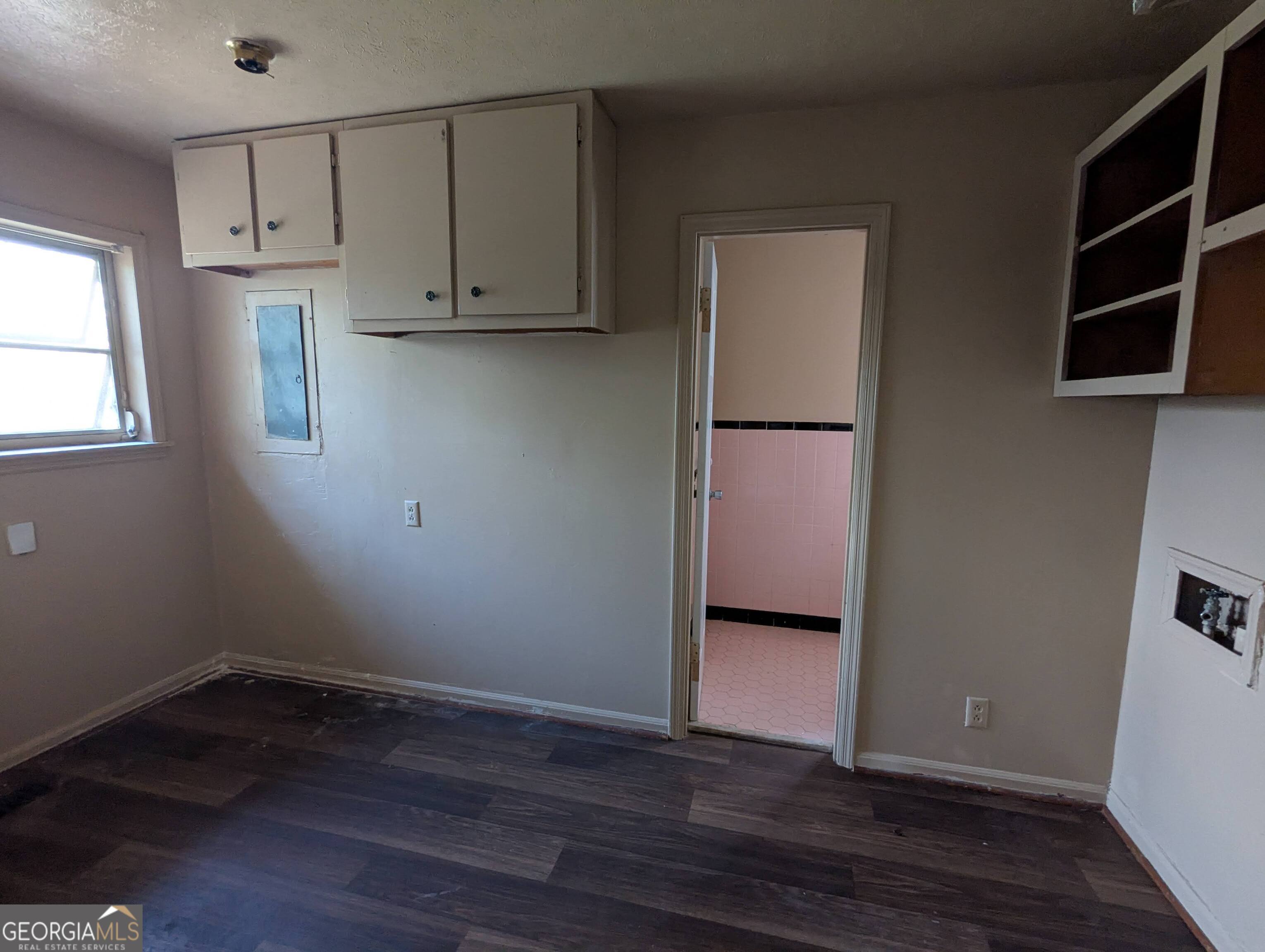 611 West Whitney Avenue Albany, GA 31701 - Photo 12 of 15 a view of cabinets and wooden floor