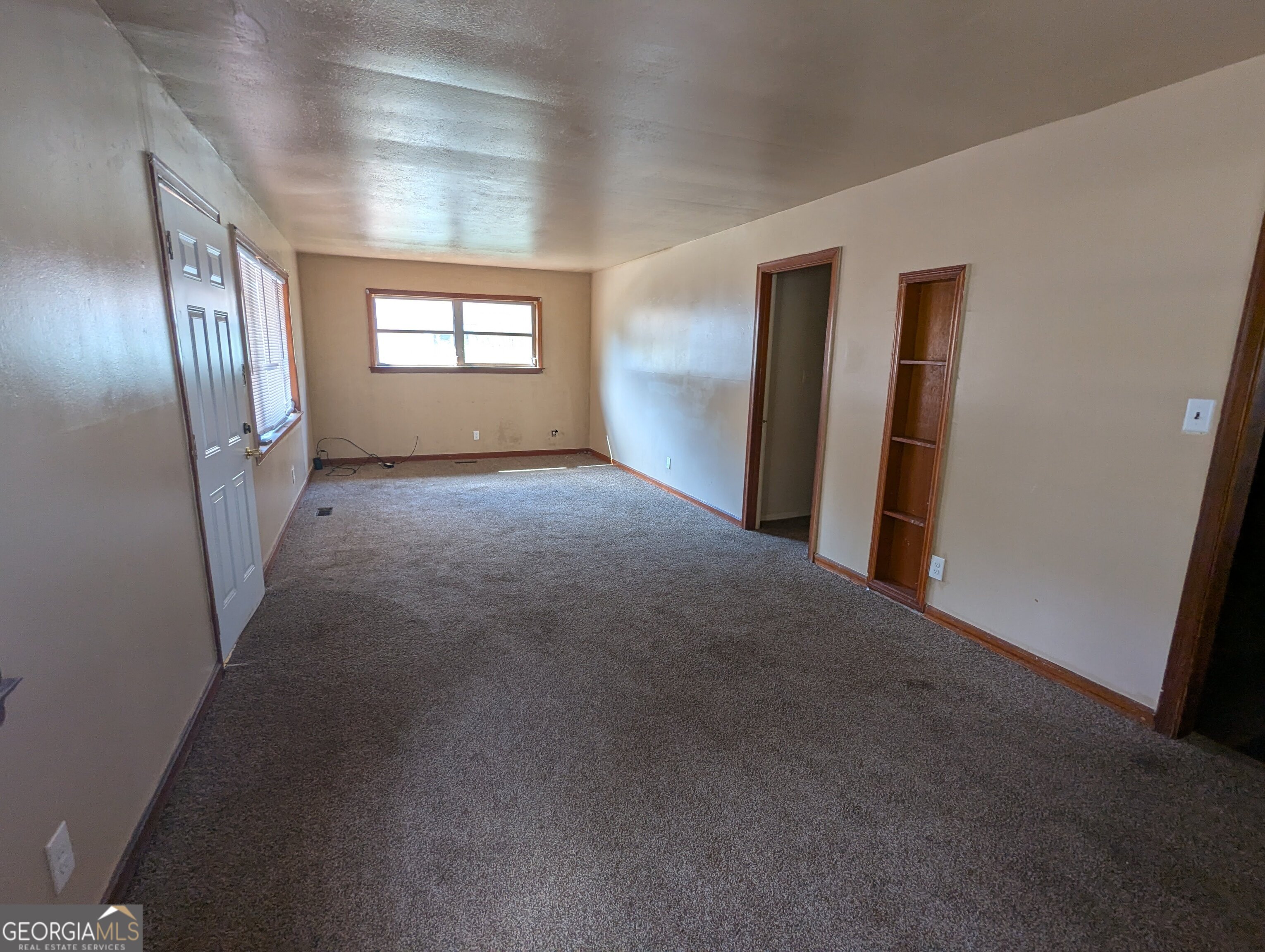 611 West Whitney Avenue Albany, GA 31701 - Photo 2 of 15 a view of empty room with windows