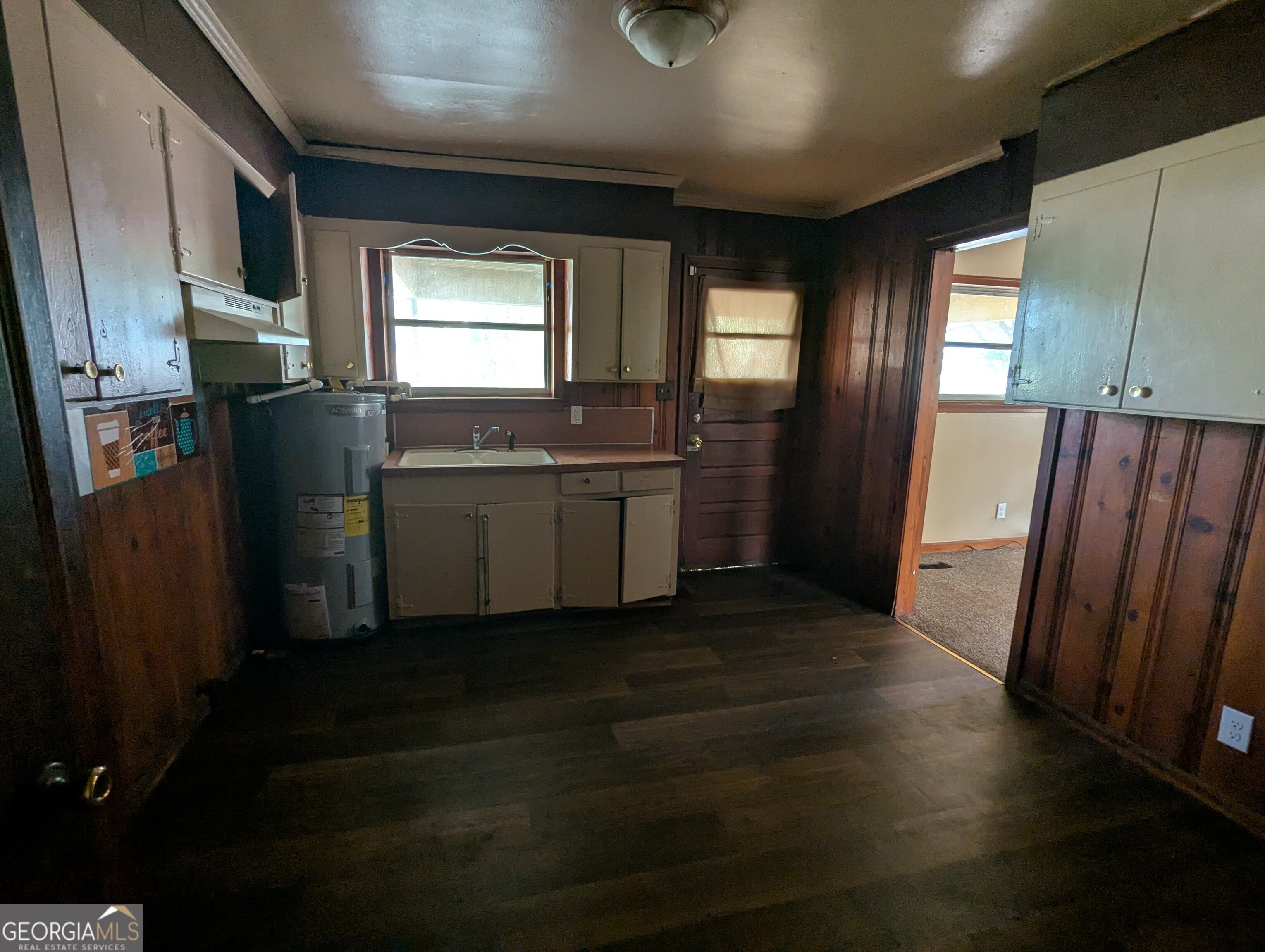 611 West Whitney Avenue Albany, GA 31701 - Photo 4 of 15 a kitchen with a refrigerator and sink
