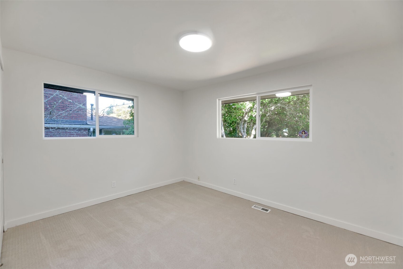 11229 29th Avenue Southwest Seattle, WA 98146 - Photo 11 of 28 an empty room with windows