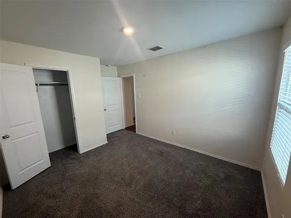 an empty room with closet