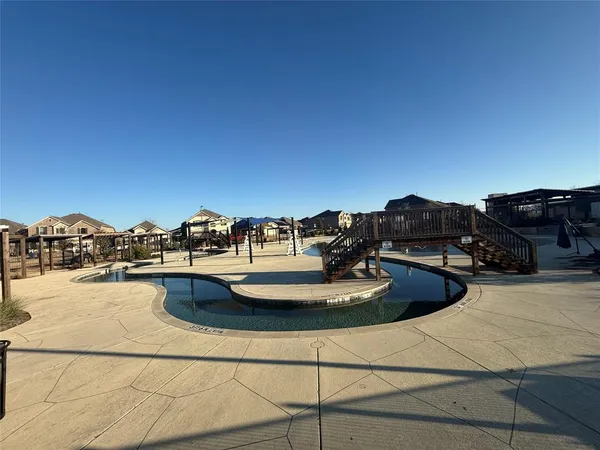 a view of a swimming pool with lounge chairs