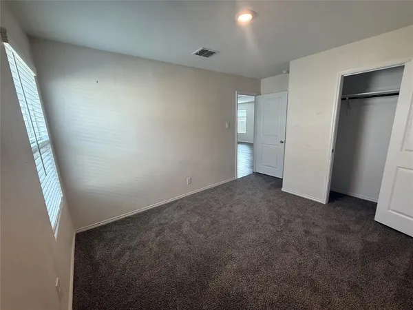 an empty room with closet