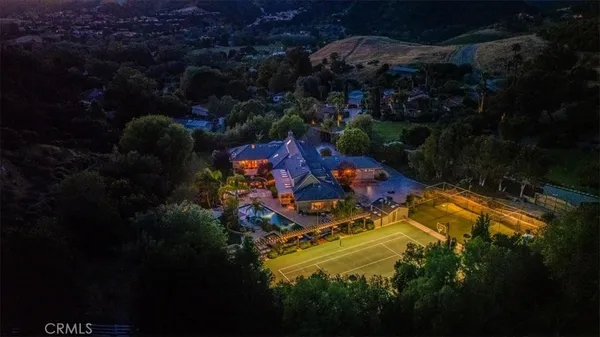 an aerial view of a house with a garden