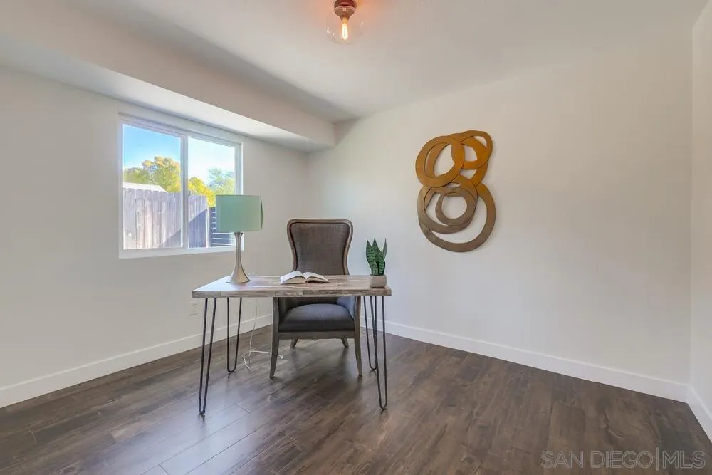 8779 Cordial Road El Cajon, CA 92021 - Photo 29 of 39 a workspace with furniture wooden floor and a window