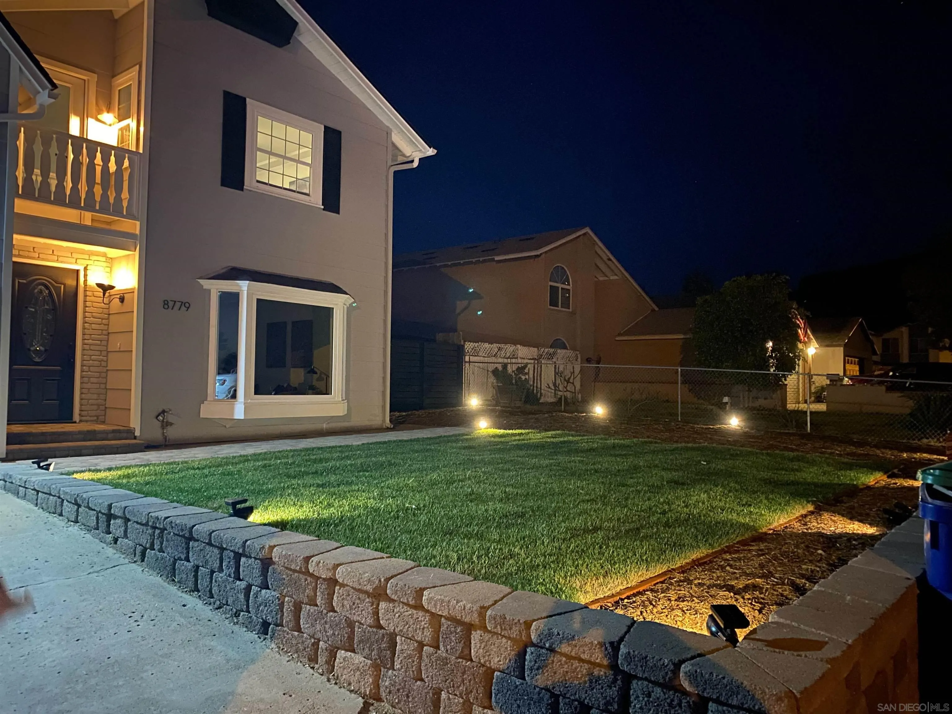 8779 Cordial Road El Cajon, CA 92021 - Photo 4 of 39 a front view of a house with a yard