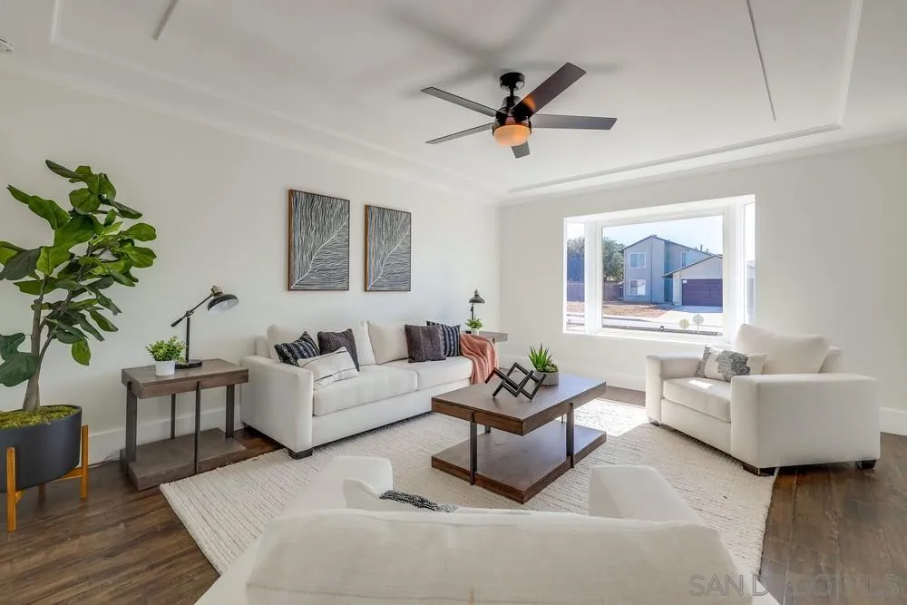 8779 Cordial Road El Cajon, CA 92021 - Photo 7 of 39 a living room with furniture and a potted plant