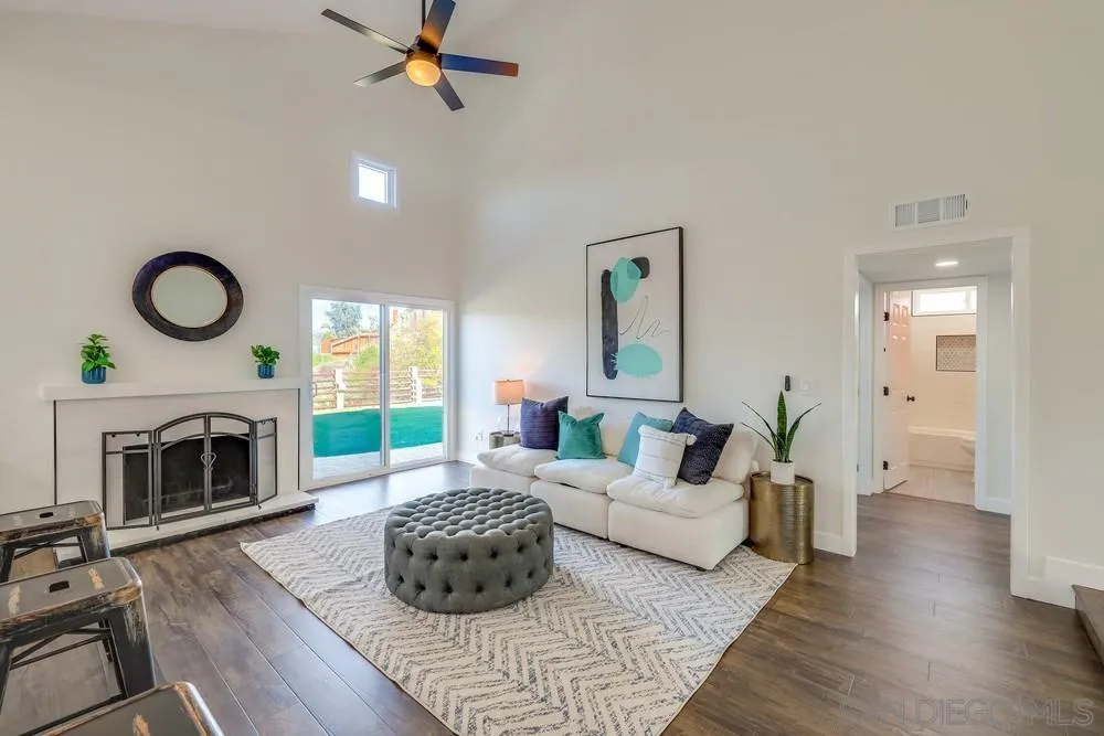 8779 Cordial Road El Cajon, CA 92021 - Photo 9 of 39 a living room with furniture and a fireplace