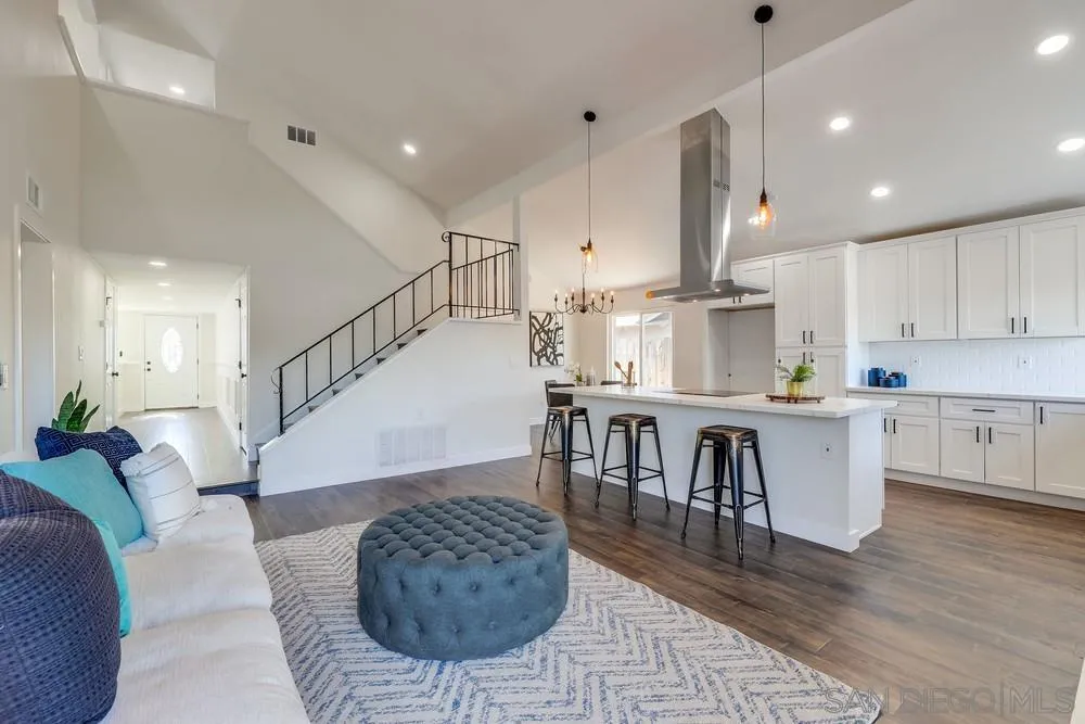 8779 Cordial Road El Cajon, CA 92021 - Photo 10 of 39 a living room with furniture a table and kitchen view