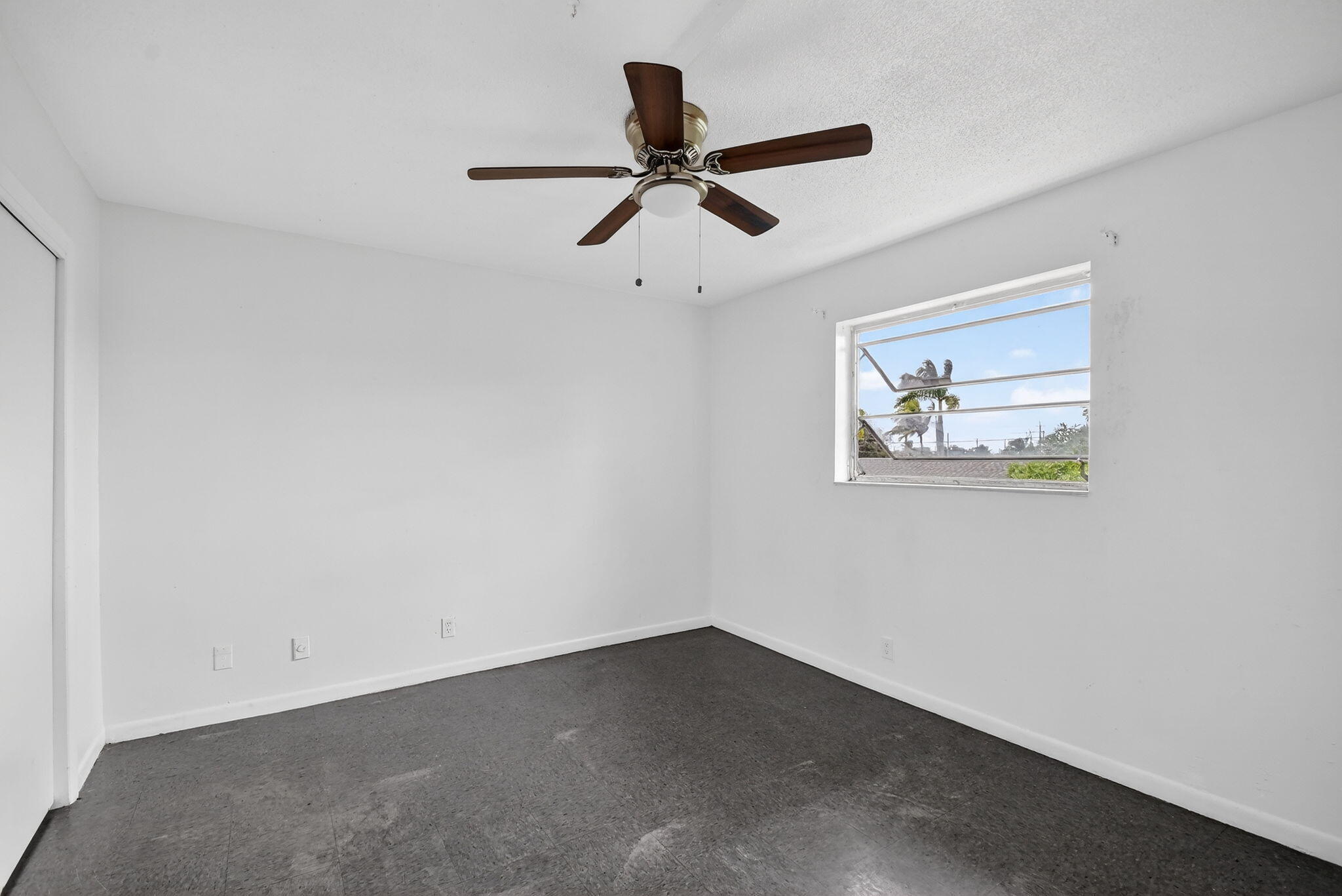 1406 Barton Road, Unit 15 Lake Worth Beach, FL 33460 - Photo 14 of 19 wooden floor in an empty room