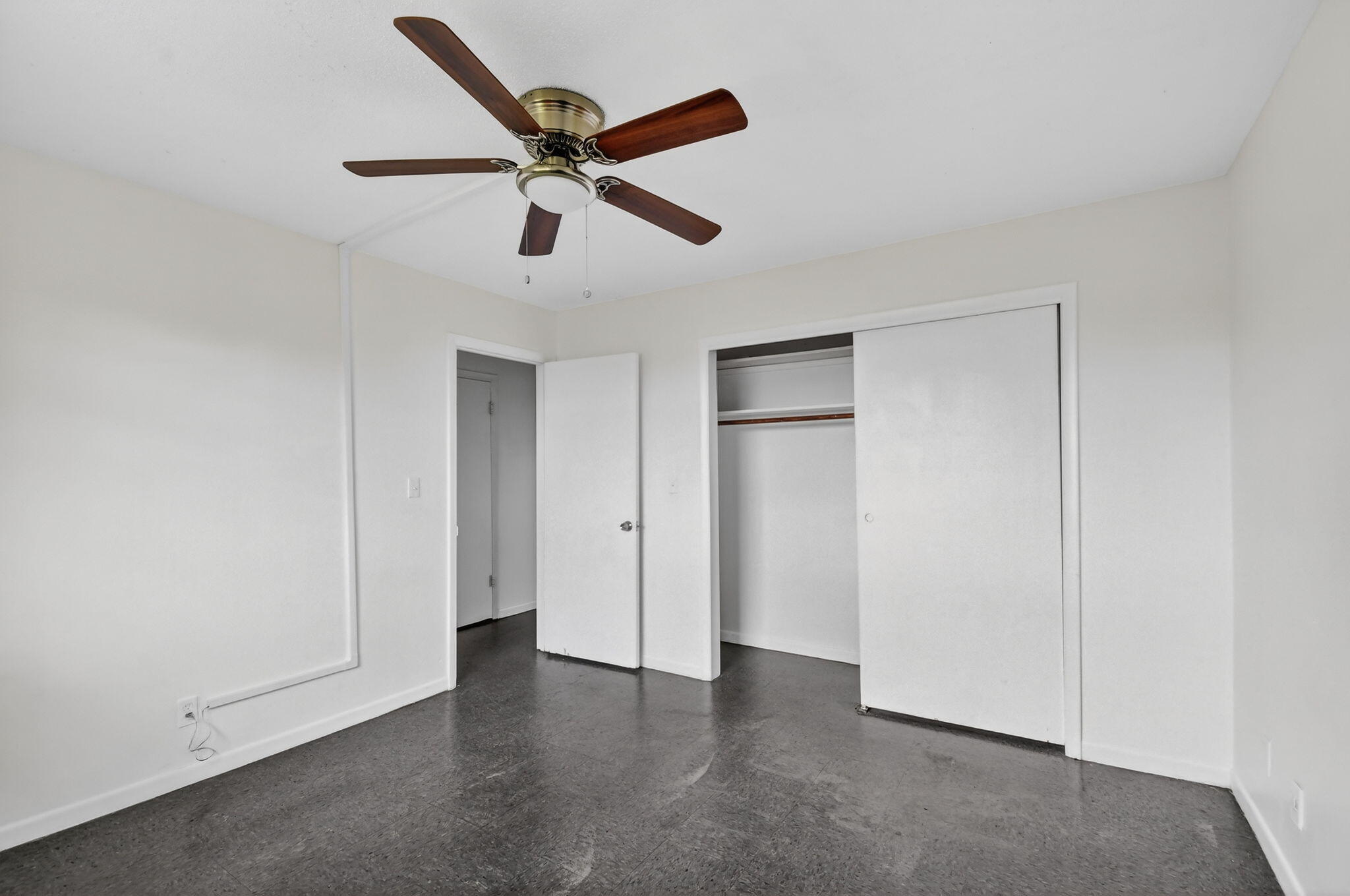 1406 Barton Road, Unit 15 Lake Worth Beach, FL 33460 - Photo 16 of 19 a view of an empty room with wooden floor