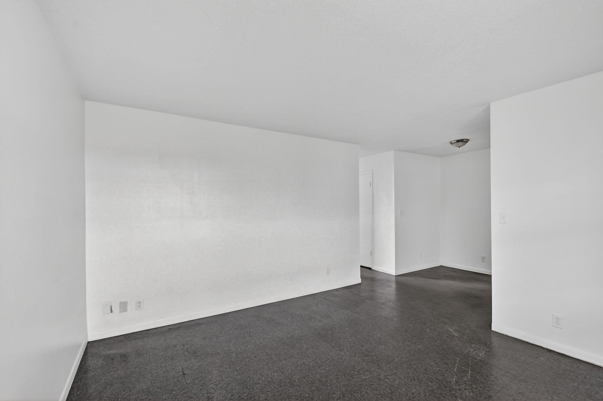 1406 Barton Road, Unit 15 Lake Worth Beach, FL 33460 - Photo 6 of 19 an empty room with a empty space