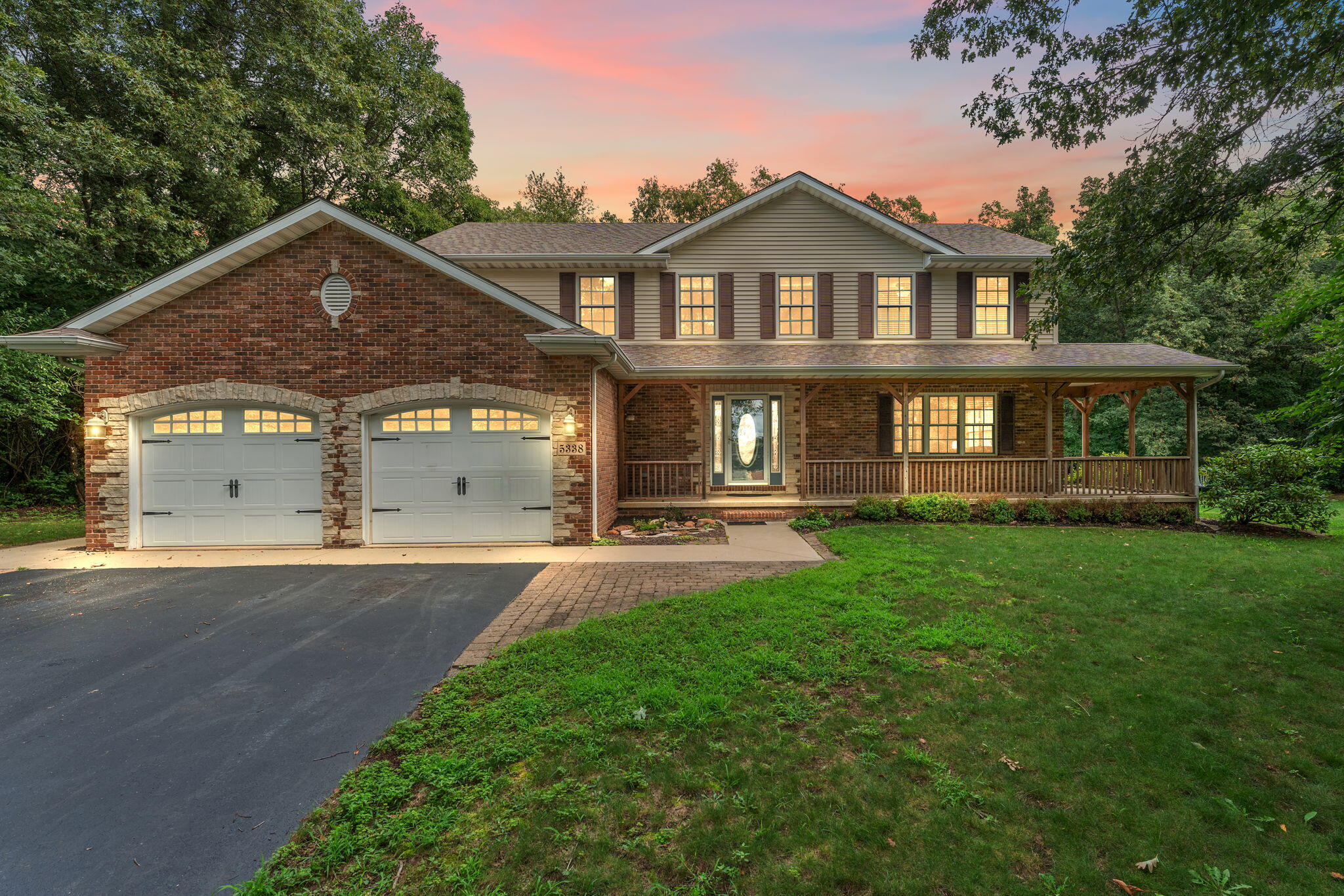 a front view of a house with yard