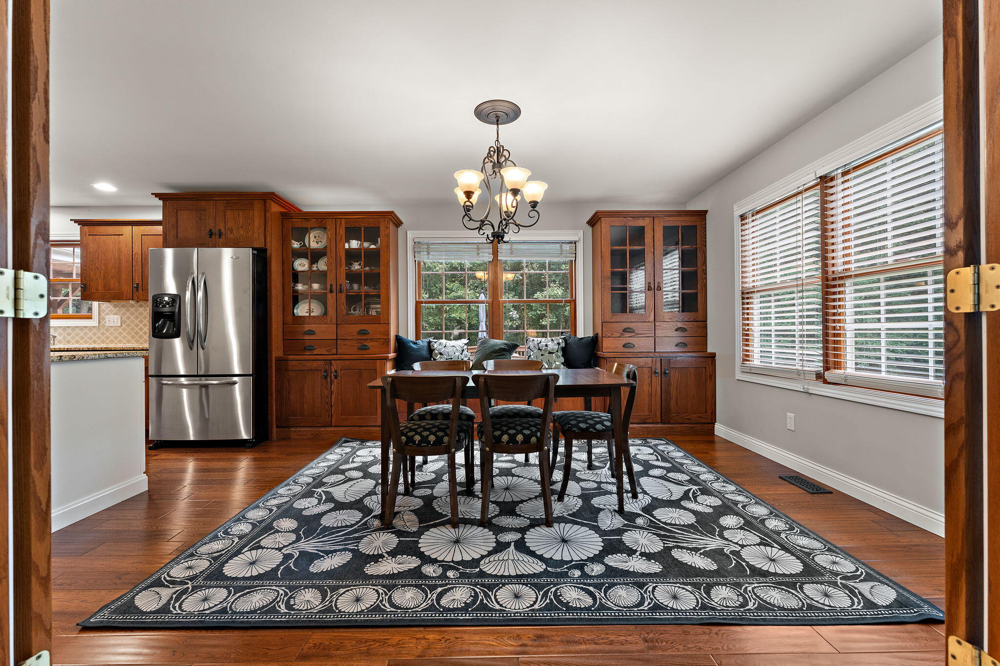 5338 East Lawler Court, Unit 67 Demotte, IN 46310 - Photo 13 of 49 a view of a dining room with furniture window and wooden floor