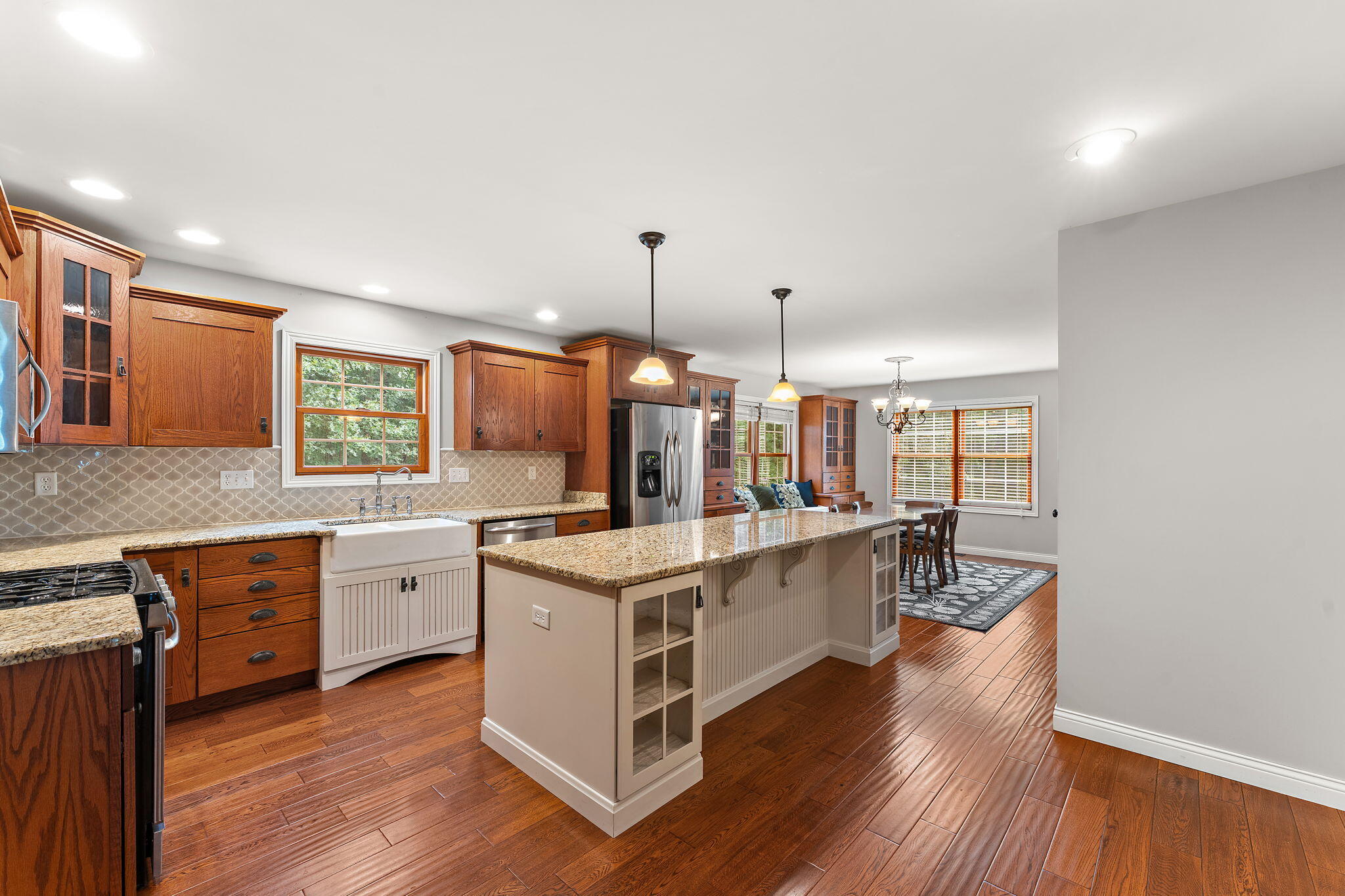 5338 East Lawler Court, Unit 67 Demotte, IN 46310 - Photo 16 of 49 a kitchen with stainless steel appliances granite countertop a stove and a wooden floors