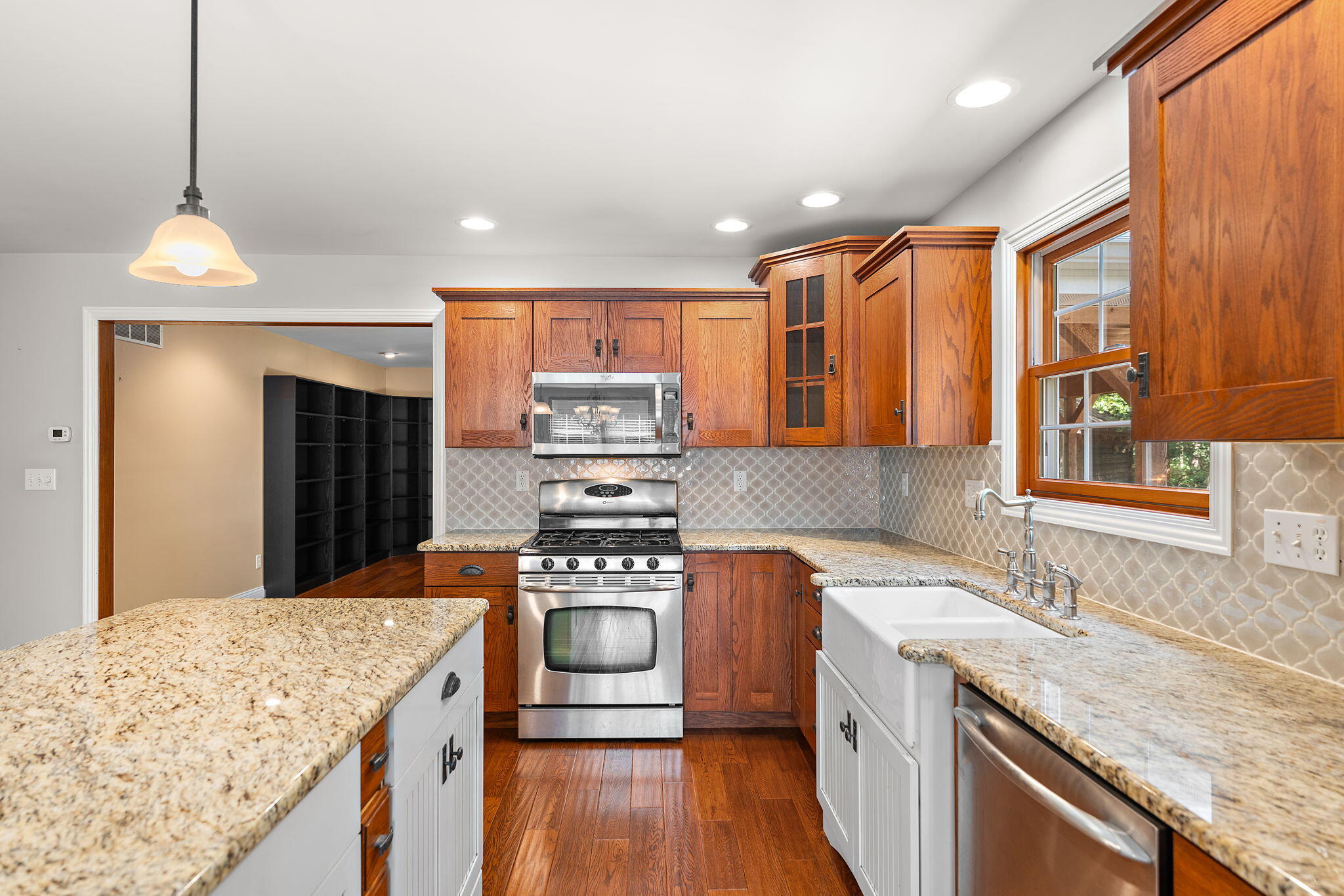 5338 East Lawler Court, Unit 67 Demotte, IN 46310 - Photo 20 of 49 a kitchen with stainless steel appliances granite countertop a sink stove and refrigerator